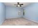 Simple bedroom features carpet, a window and a ceiling fan at 1603 Stonegate S, Sanford, NC 27332