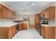 Well-lit kitchen featuring wooden cabinets, stainless steel appliances, and a seamless transition to the dining area at 1603 Stonegate S, Sanford, NC 27332