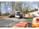 The backyard features a trailer, a car, and plenty of open space at 1614 Homewood Ave, Durham, NC 27707