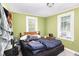 A quaint bedroom with twin windows for natural light, paired with wood-trimmed window frames at 1614 Homewood Ave, Durham, NC 27707
