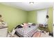 This bedroom boasts a decorative bed and a functional table with everyday essentials at 1614 Homewood Ave, Durham, NC 27707