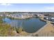 Beautiful aerial view of community homes surrounding a serene lake on a sunny day at 1628 Highpoint St, Wake Forest, NC 27587