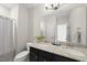 Bathroom with a double sink vanity featuring granite countertops at 1628 Highpoint St, Wake Forest, NC 27587