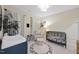 Calm Bedroom room with crib, changing table, and decorative alphabet rug at 1628 Highpoint St, Wake Forest, NC 27587