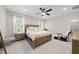 Primary bedroom featuring a ceiling fan, natural light, and neutral decor at 1628 Highpoint St, Wake Forest, NC 27587