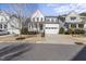 Charming two-story home featuring a welcoming front porch and a spacious two-car garage at 1628 Highpoint St, Wake Forest, NC 27587