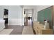 Inviting foyer featuring hardwood floors, decorative molding, and stylish accents at 1628 Highpoint St, Wake Forest, NC 27587