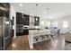 Modern kitchen with stainless steel appliances, granite countertops, and a center island with seating at 1628 Highpoint St, Wake Forest, NC 27587