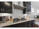 Close-up of kitchen with granite countertops, stainless steel hood, and ample counter space at 1628 Highpoint St, Wake Forest, NC 27587