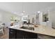 Open-concept kitchen with granite countertops and seamless flow into the living room at 1628 Highpoint St, Wake Forest, NC 27587
