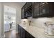 Granite countertops, custom cabinetry, and under-cabinet lighting create an elegant space at 1628 Highpoint St, Wake Forest, NC 27587