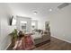 Inviting living room with ample seating, stylish rug, and a view into another room at 1628 Highpoint St, Wake Forest, NC 27587