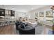 Spacious open-concept living room connected to the modern kitchen and dining area at 1628 Highpoint St, Wake Forest, NC 27587