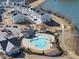 Overhead view of the community pool, clubhouse and nearby homes and lake at 1628 Highpoint St, Wake Forest, NC 27587
