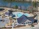 Community pool with multiple covered areas and lounge spots near the lake at 1628 Highpoint St, Wake Forest, NC 27587