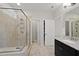 Walk-in shower with glass enclosure, tiled walls, and spa-like finishes at 1628 Highpoint St, Wake Forest, NC 27587
