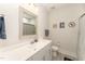 Charming bathroom with a single vanity, framed mirror, and soft, neutral colors at 197 S Clearbook Ct, Angier, NC 27501