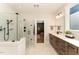 Luxurious bathroom featuring a glass shower, double vanity, and modern fixtures at 197 S Clearbook Ct, Angier, NC 27501