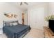 Comfortable bedroom featuring a blue duvet, natural light, and closet at 197 S Clearbook Ct, Angier, NC 27501