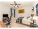Inviting bedroom with a ceiling fan, TV, and sports-themed decor for a youthful vibe at 197 S Clearbook Ct, Angier, NC 27501
