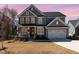 Charming two-story home with a well-manicured lawn and inviting front porch at 197 S Clearbook Ct, Angier, NC 27501