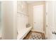 Hallway with a decorative bench seat and wainscoting near the front door at 197 S Clearbook Ct, Angier, NC 27501