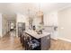 Modern kitchen features a spacious island with bar stools, stainless steel appliances, and pendant lighting at 197 S Clearbook Ct, Angier, NC 27501