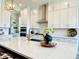 Modern kitchen featuring a large island, stainless steel appliances, and white cabinetry at 197 S Clearbook Ct, Angier, NC 27501