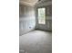Unfinished bedroom showing the window and the drywall before painting at 200 Dove Rd, Cameron, NC 28326