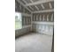 Bedroom featuring unfinished walls and flooring, a large window overlooking the yard at 200 Dove Rd, Cameron, NC 28326