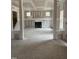 Large living room with a fireplace, bare walls, unfinished flooring and three large windows at 200 Dove Rd, Cameron, NC 28326