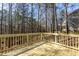 A wooden back deck with view of the surrounding woods, ideal for enjoying nature and the outdoors at 244 Victor Ct, Garner, NC 27529