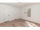 Clean bedroom featuring modern vinyl flooring, fresh paint and updated lighting at 244 Victor Ct, Garner, NC 27529