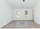Bright bedroom with two windows, neutral walls, and light-colored flooring at 244 Victor Ct, Garner, NC 27529