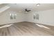 Open Bonus Room with recessed lighting, modern ceiling fan, light walls, and wood-look floors at 244 Victor Ct, Garner, NC 27529