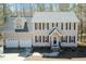 An aerial view of a stunning two-story home featuring a two-car garage and professionally landscaped yard at 244 Victor Ct, Garner, NC 27529