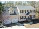 Charming two-story home featuring a two-car garage and a well-manicured front yard with a tree at 244 Victor Ct, Garner, NC 27529