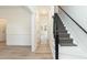 Bright foyer showing stairway and hallway with light wood flooring and fresh, neutral paint throughout at 244 Victor Ct, Garner, NC 27529