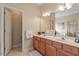 Spacious bathroom featuring a double vanity, ample counter space, and a neutral color scheme at 2524 Forest Shadows Ln, Raleigh, NC 27614