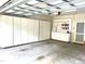 Garage featuring built-in storage cabinets and shelving for organization and convenience at 2524 Forest Shadows Ln, Raleigh, NC 27614