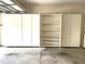 Garage featuring wall storage cabinets for organization and convenience at 2524 Forest Shadows Ln, Raleigh, NC 27614