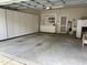 Spacious garage featuring built-in storage cabinets and shelving for organization and convenience at 2524 Forest Shadows Ln, Raleigh, NC 27614