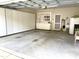 Spacious garage featuring built-in storage cabinets and shelving for organization and convenience at 2524 Forest Shadows Ln, Raleigh, NC 27614