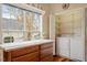 Bright laundry area with a side-by-side washer and dryer, featuring a folding counter and ample natural light at 2524 Forest Shadows Ln, Raleigh, NC 27614