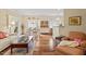 Spacious living room with hardwood floors and a view of the dining area at 2524 Forest Shadows Ln, Raleigh, NC 27614
