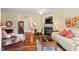 Cozy living room with hardwood floors, fireplace, and comfortable seating at 2524 Forest Shadows Ln, Raleigh, NC 27614