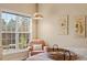 Bright bedroom with tray ceiling, hardwood floors, a fan and a window at 2524 Forest Shadows Ln, Raleigh, NC 27614