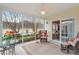 Inviting screened porch with comfortable seating and views of landscaped yard at 2524 Forest Shadows Ln, Raleigh, NC 27614