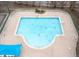 Aerial view of a large community swimming pool with lifeguard stands at 2524 Forest Shadows Ln, Raleigh, NC 27614