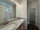 Bathroom with double vanity, granite countertop, and a shower with glass door at 274 Longbow Dr, Middlesex, NC 27557